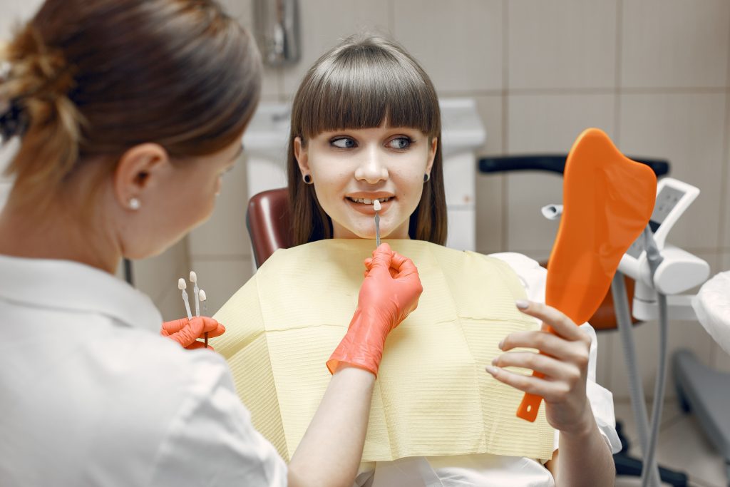 Dentist working on a patient's smile restoration