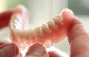 Removable full dentures shown to patients during a consultation in Ogden, UT